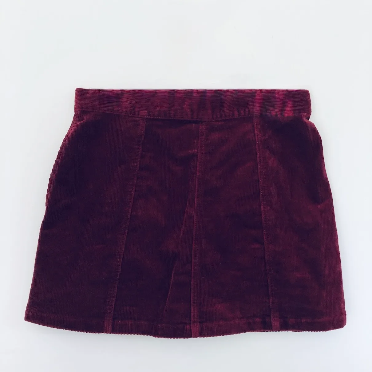 wine red mini skirt, Afends corduroy skirt, vintage-inspired mini, burgundy button skirt