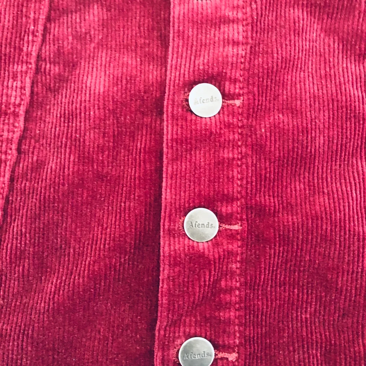 wine red mini skirt, Afends corduroy skirt, vintage-inspired mini, burgundy button skirt