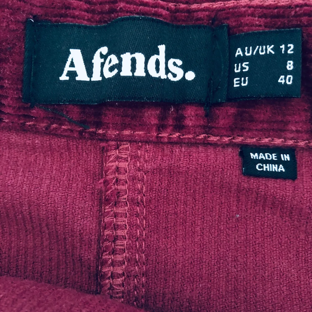 wine red mini skirt, Afends corduroy skirt, vintage-inspired mini, burgundy button skirt