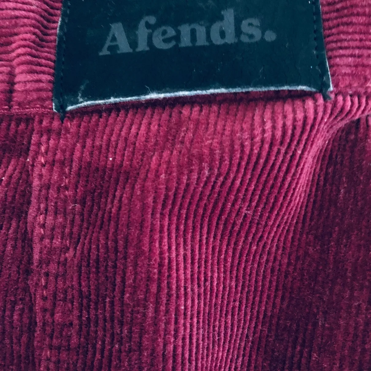 wine red mini skirt, Afends corduroy skirt, vintage-inspired mini, burgundy button skirt